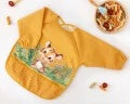 BABERO IMPERMEABLE CON MANGAS TIGRE MOSTAZA
